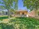 Charming backyard with a patio and well-maintained lawn, ideal for outdoor entertaining and relaxation at 946 Champion Cir, Longmont, CO 80503