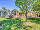Inviting backyard featuring a well-kept lawn and mature landscaping, perfect for outdoor enjoyment at 946 Champion Cir, Longmont, CO 80503