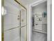Bathroom featuring a glass-enclosed shower and walk-in closet with custom shelving at 946 Champion Cir, Longmont, CO 80503