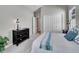 Cozy bedroom with soft carpet and a full-size bed sits next to a dresser and closet at 946 Champion Cir, Longmont, CO 80503