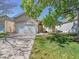 Charming single-story home with a well-manicured lawn and an attached two-car garage at 946 Champion Cir, Longmont, CO 80503