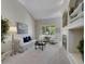 Bright living room featuring a fireplace, built-in shelves, and large windows at 946 Champion Cir, Longmont, CO 80503
