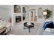 Cozy living room with a fireplace, decorative shelving, and neutral decor at 946 Champion Cir, Longmont, CO 80503