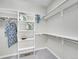 Organized walk-in closet featuring custom shelving and ample storage space for clothes and accessories at 946 Champion Cir, Longmont, CO 80503