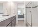 Stylish bathroom with a glass shower, modern fixtures, and access to a bedroom, offering convenience and luxury at 2080 Alcott Way, Broomfield, CO 80023