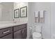 Bathroom with sleek vanity, framed art above the toilet, and shower/tub combo at 2080 Alcott Way, Broomfield, CO 80023