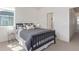 Bright bedroom with a queen bed, large windows, and neutral decor, creating a calming atmosphere at 2080 Alcott Way, Broomfield, CO 80023