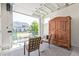 Flex room with furniture, armoire and open garage door featuring neighborhood view at 2080 Alcott Way, Broomfield, CO 80023