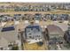 High-angle shot displays neighborhood homes with solar panels and backyard trampoline, suburban living at 4884 St Vrain Rd, Firestone, CO 80504