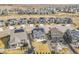 Neighborhood aerial view showcasing houses with solar panels and well-kept yards at 4884 St Vrain Rd, Firestone, CO 80504