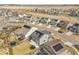 Aerial view of homes in the neighborhood featuring solar panels and spacious backyard at 4884 St Vrain Rd, Firestone, CO 80504