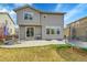 Large backyard with grass and a patio, perfect for outdoor entertaining and relaxation at 4884 St Vrain Rd, Firestone, CO 80504