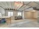 Unfinished basement with white plastic wall coverings and exposed ductwork at 4884 St Vrain Rd, Firestone, CO 80504