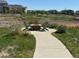 Inviting outdoor community space featuring seating around a stone fire pit at 4884 St Vrain Rd, Firestone, CO 80504