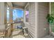 Inviting front porch with seating and ample space for relaxing and enjoying the neighborhood views at 4884 St Vrain Rd, Firestone, CO 80504