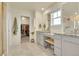 Well-lit bathroom with double vanity, granite countertops, and a walk-in closet at 4884 St Vrain Rd, Firestone, CO 80504