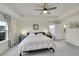 Serene main bedroom with neutral colors, tray ceiling, and natural light at 4884 St Vrain Rd, Firestone, CO 80504