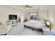 Large main bedroom with tray ceiling, sitting area, and an ensuite bathroom at 4884 St Vrain Rd, Firestone, CO 80504