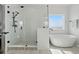 Spa-like bathroom featuring a modern tub and glass-enclosed shower with beautiful finishes at 1136 Hillside Ln, Louisville, CO 80027
