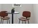 Intimate dining nook features a round table with brown leather chairs, perfect for cozy meals at 1136 Hillside Ln, Louisville, CO 80027
