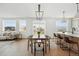Dining area featuring modern furniture with an open view of kitchen and living area at 1136 Hillside Ln, Louisville, CO 80027