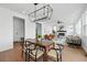 Modern dining room with a stylish light fixture and a view of the fireplace at 1136 Hillside Ln, Louisville, CO 80027