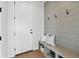 Mud room features a bench, storage, and coat hooks at 1136 Hillside Ln, Louisville, CO 80027