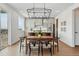 Contemporary dining area featuring stylish seating, seamless access to the kitchen and great natural light at 1136 Hillside Ln, Louisville, CO 80027