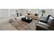 Spacious living room with modern decor, plush seating, and ample natural light at 1136 Hillside Ln, Louisville, CO 80027