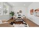 Bright office space with a large window, stylish decor, and neutral color palette at 1136 Hillside Ln, Louisville, CO 80027