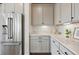 Pantry features modern cabinets, stainless steel refrigerator, and light countertops at 1136 Hillside Ln, Louisville, CO 80027