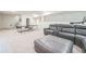 Finished basement features a ping pong table, leather sectional, and carpet floors at 6311 Stable View St, Castle Pines, CO 80108
