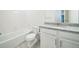 Bright bathroom features a tub, tile floor, and granite countertop with white vanity at 6311 Stable View St, Castle Pines, CO 80108