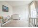 Charming Bedroom with a changing table, crib, and ample storage, creating a functional and organized space at 6311 Stable View St, Castle Pines, CO 80108