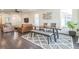 Open-concept living and dining area featuring hardwood floors and modern decor at 6311 Stable View St, Castle Pines, CO 80108