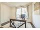 Functional home office with a spacious desk, modern chair, and natural light, perfect for remote work at 6311 Stable View St, Castle Pines, CO 80108