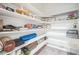 Walk-in pantry featuring multiple shelves for optimized storage and organization at 6311 Stable View St, Castle Pines, CO 80108