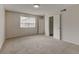 Bright and airy bedroom featuring neutral walls, plush carpeting, and a double closet at 3855 S Monaco St # 177, Denver, CO 80237