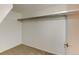 Ample closet space with carpeted floors and a rod for hanging clothes, providing practical storage solutions at 3855 S Monaco St # 177, Denver, CO 80237