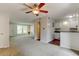 Open concept living area with breakfast bar, generous lighting, and convenient flow to the kitchen and living spaces at 3855 S Monaco St # 177, Denver, CO 80237