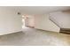 Expansive living room with stairs, neutral carpet, and a seamless flow for comfortable living and entertaining at 3855 S Monaco St # 177, Denver, CO 80237