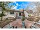 Backyard featuring a patio, egg chair, and lounge furniture surrounded by trees at 4408 E 107Th Pl, Thornton, CO 80233