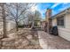 Backyard featuring a patio with outdoor furniture, walking path, and mature trees at 4408 E 107Th Pl, Thornton, CO 80233