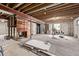 Spacious unfinished basement featuring exposed ceiling, carpeted area, and wood-accent features at 4408 E 107Th Pl, Thornton, CO 80233