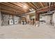 Unfinished basement featuring a utility area with a washer and dryer hookup at 4408 E 107Th Pl, Thornton, CO 80233