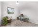 Well-lit bedroom has wood floors and natural light with a comfy chair and vinyl player at 4408 E 107Th Pl, Thornton, CO 80233