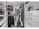Walk-in closet features custom shelving and hanging racks, providing ample storage space at 4408 E 107Th Pl, Thornton, CO 80233