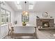 Inviting dining area with brick fireplace, skylights, and large windows offering ample natural light at 4408 E 107Th Pl, Thornton, CO 80233