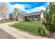Beautiful single-Gathering brick home featuring a well-manicured lawn and mature trees at 4408 E 107Th Pl, Thornton, CO 80233