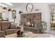 Cozy fireplace with stylish decor, an open concept, and views of the backyard at 4408 E 107Th Pl, Thornton, CO 80233